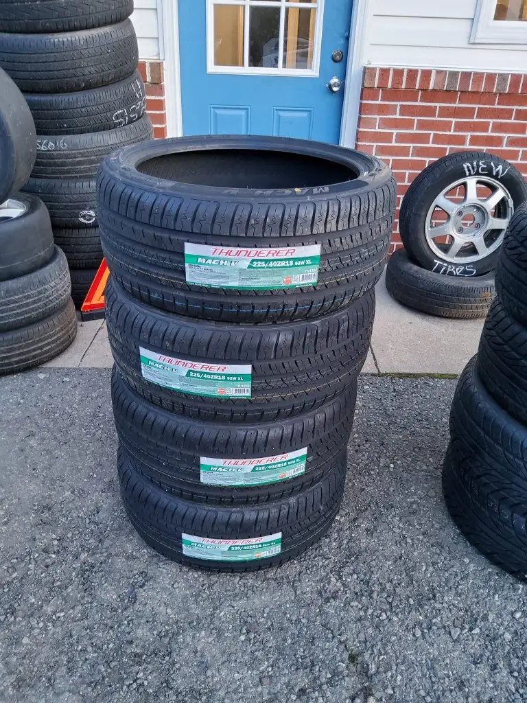 A stack of tires arranged vertically, showcasing their rubber texture and circular shape.
